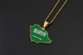 Saudi Arabia-shaped pendant with flag colors on a gold chain