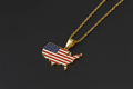USA-shaped pendant with flag colors on a gold chain