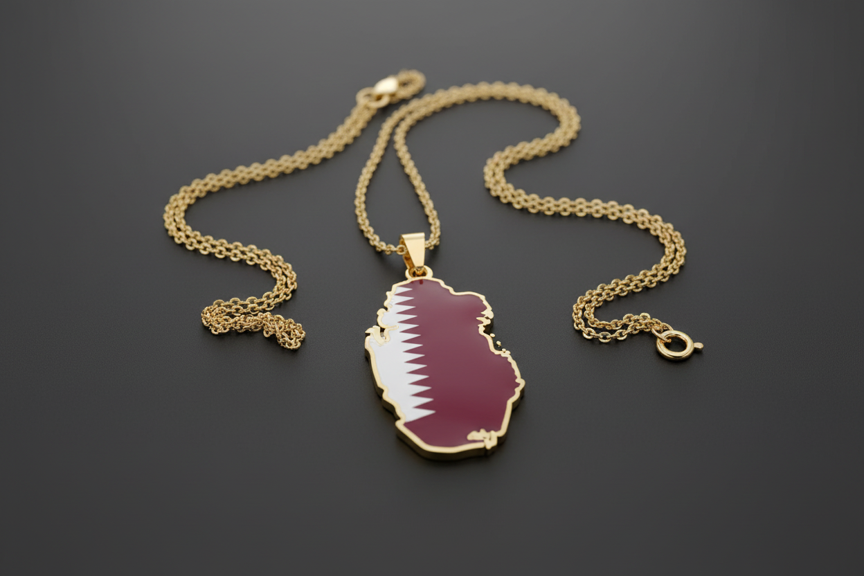 Qatar-shaped pendant with flag colors on a gold chain