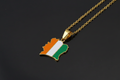 Ivory Coast-shaped pendant with flag colors on a gold chain